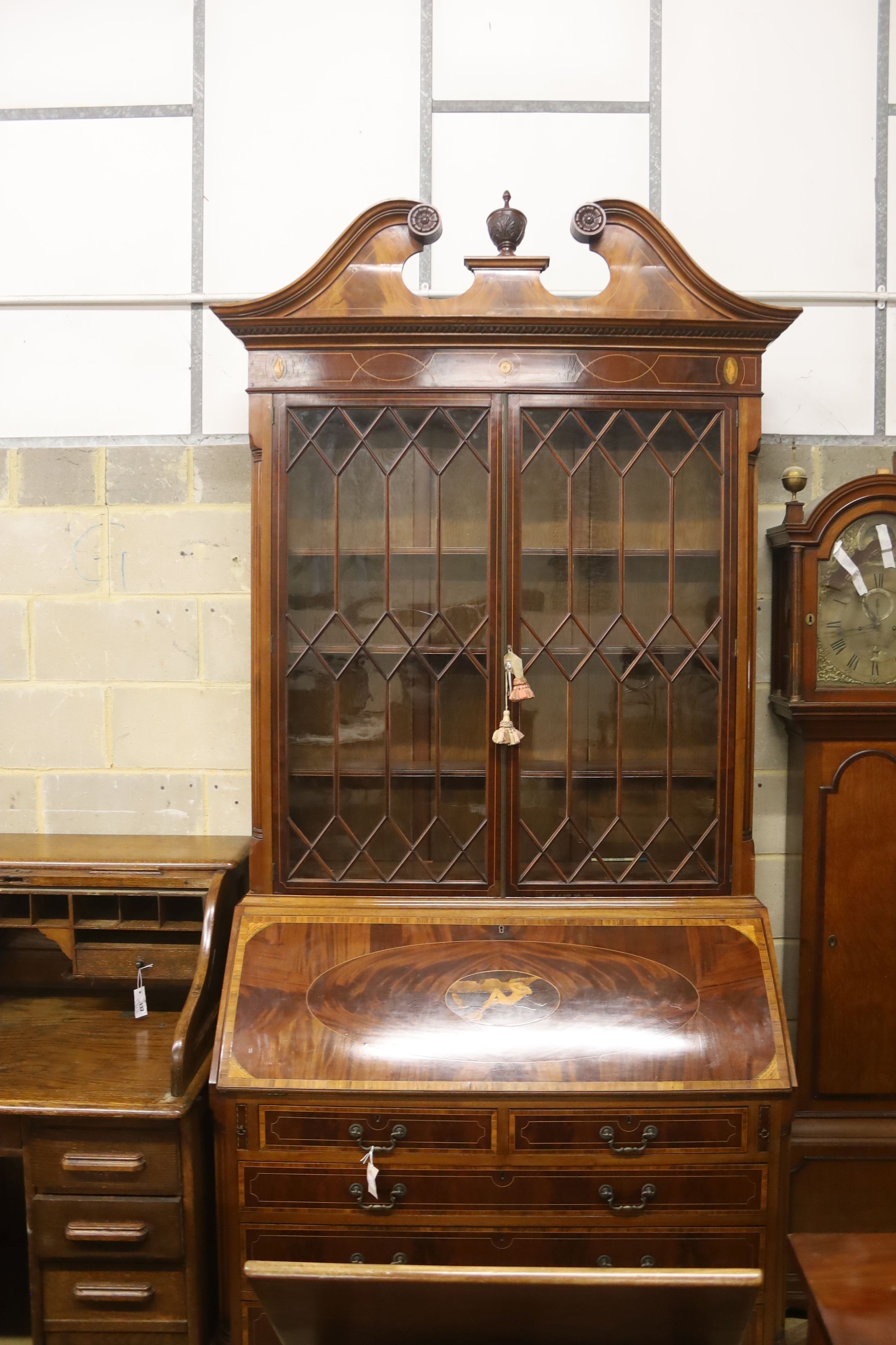 A George III style inlaid mahogany bureau bookcase, length 132cm, depth 57cm, height 276cm